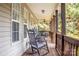Inviting covered porch with rocking chairs and a ceiling fan, perfect for relaxing at 7691 Red Robin Trl, Denver, NC 28037