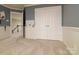 Bedroom with double doors, neutral carpet and tones, offering a blank canvas for personalization at 9913 Hazelview Dr, Charlotte, NC 28277