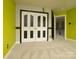 Bright bedroom features a closet and unique wall accents, adding character to the space at 9913 Hazelview Dr, Charlotte, NC 28277