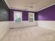 Stylish bedroom with ample natural light from two windows and painted in two-tone color at 9913 Hazelview Dr, Charlotte, NC 28277