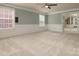 Spacious bonus room with wainscoting and natural light, creating a versatile living area at 9913 Hazelview Dr, Charlotte, NC 28277