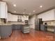 Modern kitchen features stainless steel appliances, granite countertops, and hardwood floors at 9913 Hazelview Dr, Charlotte, NC 28277