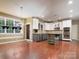 This kitchen features an island and stainless steel appliances at 9913 Hazelview Dr, Charlotte, NC 28277