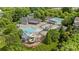 Aerial view of community pool and clubhouse surrounded by lush greenery at 10206 Linksland Dr, Huntersville, NC 28078