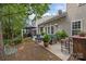 Relaxing outdoor patio and outdoor seating area with lush backyard at 10206 Linksland Dr, Huntersville, NC 28078