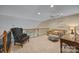Loft featuring an armchair, sofa, ceiling fan, and ottoman at 10206 Linksland Dr, Huntersville, NC 28078