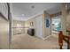 Upstairs hallway with carpet flooring, white doors, and neutral paint at 10206 Linksland Dr, Huntersville, NC 28078