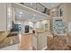Bright kitchen featuring stainless appliances, granite countertops and a view of the stairway at 10206 Linksland Dr, Huntersville, NC 28078