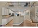 Spacious kitchen with white cabinetry, granite countertops, and stainless steel appliances at 10206 Linksland Dr, Huntersville, NC 28078