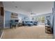 Spacious living room with natural light, ceiling fan, and modern decor at 10206 Linksland Dr, Huntersville, NC 28078