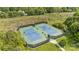 Aerial shot of community tennis courts surrounded by lush greenery at 10206 Linksland Dr, Huntersville, NC 28078