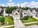 Inviting two-story home with a manicured lawn, two-car garage, and charming landscaping in a suburban neighborhood at 1033 Crawford Dr, Lancaster, SC 29720