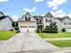Charming two-story home with beautiful landscaping, spacious driveway, and inviting curb appeal in a residential area at 1033 Crawford Dr, Lancaster, SC 29720