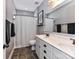 Bathroom featuring a double sink vanity with granite countertop and black hardware at 10515 Royal Winchester Dr, Charlotte, NC 28277