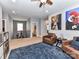 Spacious bonus room featuring plush seating, unique artwork and a view of the stairway and bathroom at 10515 Royal Winchester Dr, Charlotte, NC 28277