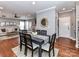 This dining room features hardwood floors, updated lighting, and modern furnishings at 10515 Royal Winchester Dr, Charlotte, NC 28277