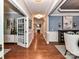 Spacious hallway showcasing hardwood floors and access to multiple rooms at 10515 Royal Winchester Dr, Charlotte, NC 28277