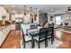 Open concept kitchen flows to dining area with stainless appliances and granite countertops at 10515 Royal Winchester Dr, Charlotte, NC 28277