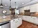 Charming kitchen features granite counters, brick backsplash, and stainless steel appliances at 10515 Royal Winchester Dr, Charlotte, NC 28277