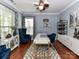 Stylish home office with a modern desk, ample seating, and great natural light at 10515 Royal Winchester Dr, Charlotte, NC 28277