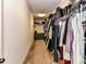 Spacious walk-in closet with ample hanging and storage space, including shelves and a dresser at 10515 Royal Winchester Dr, Charlotte, NC 28277