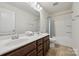 Bathroom featuring a double sink vanity and neutral tile floors at 107 Sequoia St, Mooresville, NC 28117