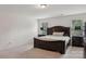 Comfortable bedroom featuring a plush bed and natural light from two bright windows at 107 Sequoia St, Mooresville, NC 28117