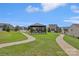 Beautiful neighborhood common area with covered picnic area and winding sidewalks among well-manicured lawns at 107 Sequoia St, Mooresville, NC 28117
