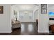 Elegant dining room with hardwood floors, chandelier, wainscoting, and a comfortable armchair at 107 Sequoia St, Mooresville, NC 28117