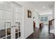 Inviting foyer with hardwood floors, a view of the living room, and charming glass-paned doors at 107 Sequoia St, Mooresville, NC 28117