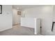 Hallway featuring neutral carpet and white walls with stairway access at 107 Sequoia St, Mooresville, NC 28117