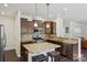 Open kitchen with stainless appliances, granite countertops, and a breakfast bar island with seating at 107 Sequoia St, Mooresville, NC 28117
