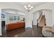 Open-concept living room featuring hardwood floors, a decorative fireplace, and bright, arched entryways at 107 Sequoia St, Mooresville, NC 28117