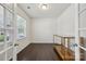 Bright home office featuring hardwood floors, a window, and double doors for easy access at 107 Sequoia St, Mooresville, NC 28117