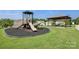 Neighborhood playground featuring a slide and picnic area offering Gathering fun with ample green space and mature trees at 107 Sequoia St, Mooresville, NC 28117