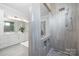 Elegant bathroom featuring a large walk-in shower with tiled walls and floors at 111 Monbo Meadows Ln, Statesville, NC 28677