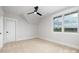 Bright bedroom with a large window, ceiling fan, and plush carpet at 111 Monbo Meadows Ln, Statesville, NC 28677