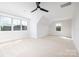 Spacious bedroom with three large windows and carpeted flooring at 111 Monbo Meadows Ln, Statesville, NC 28677