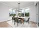 Inviting dining area with large windows offering picturesque views and modern decor at 111 Monbo Meadows Ln, Statesville, NC 28677