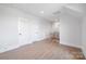 Hallway with hardwood floors, white trim, and neutral walls at 111 Monbo Meadows Ln, Statesville, NC 28677