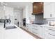 Well-equipped kitchen boasts stainless steel appliances, white cabinetry, and a stylish backsplash at 111 Monbo Meadows Ln, Statesville, NC 28677