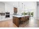 Bright kitchen features a center island with seating, modern appliances, and ample countertop space at 111 Monbo Meadows Ln, Statesville, NC 28677