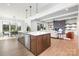 Bright, open kitchen with island, modern appliances, and seamless flow to dining and living areas at 111 Monbo Meadows Ln, Statesville, NC 28677