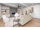 Open-concept living room featuring modern fireplace, and an open view of the entryway at 111 Monbo Meadows Ln, Statesville, NC 28677