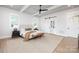 Bright main bedroom featuring a ceiling fan, natural light, and hardwood floors at 111 Monbo Meadows Ln, Statesville, NC 28677