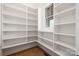 Organized pantry with shelving providing ample storage space and a well-lit interior at 111 Monbo Meadows Ln, Statesville, NC 28677