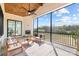 Inviting screened-in porch with comfortable seating and a scenic view at 111 Monbo Meadows Ln, Statesville, NC 28677