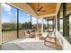 Inviting screened-in porch with comfortable seating and a scenic view at 111 Monbo Meadows Ln, Statesville, NC 28677