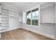 Spacious walk-in closet with built-in shelving and a large window at 111 Monbo Meadows Ln, Statesville, NC 28677