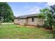 Exterior shot of the home highlighting the yard and the rustic charm of the property at 112 Gays Chapel Rd, Statesville, NC 28625